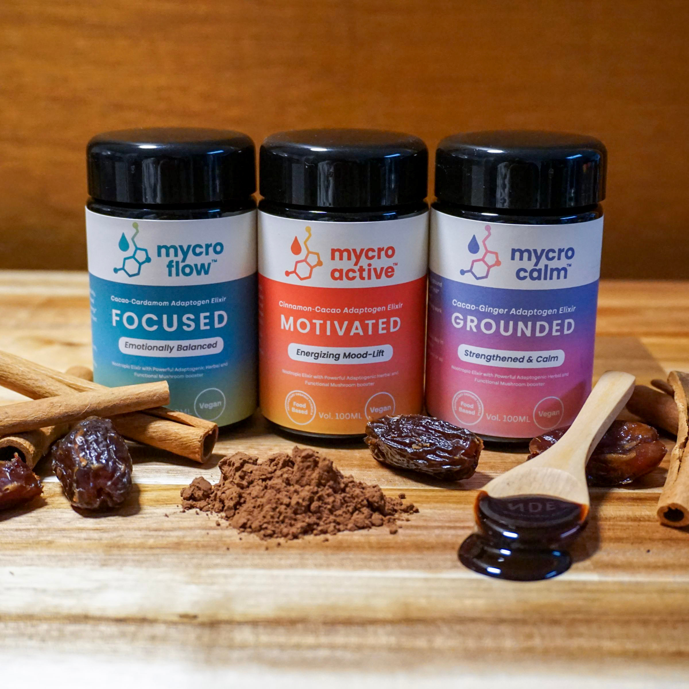 Product image of Mycrodrops elixir collection with raw ingredients for the elixirs presented in a pleasing manner 