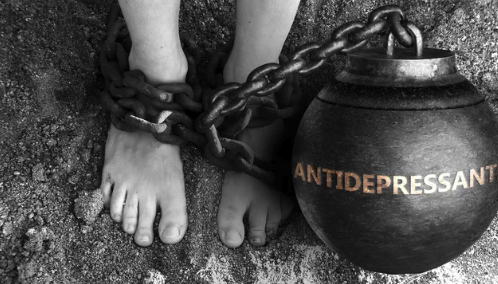 womans foot with ball and chain labled antidepressants